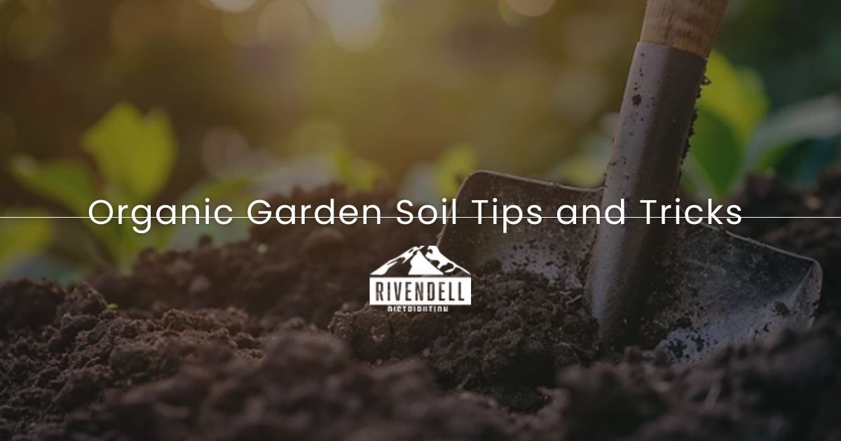 Dark soil with gardening shovel, organic gardening tips