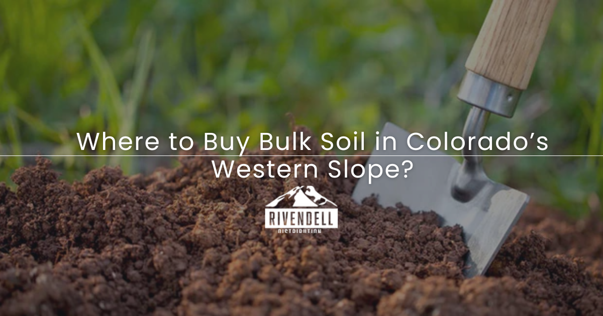 Garden trowel pushed into dark soil with article title overlay: Where to Buy Bulk Soil in Colorado's Western Slope?