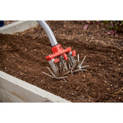 Closeup of DiscCULTIVATOR head turning soft garden soil.