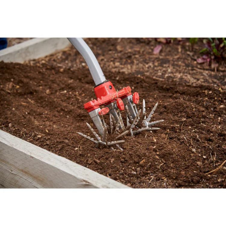 Closeup of DiscCULTIVATOR head turning soft garden soil.