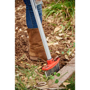 Closeup of Corona EdgeMASTER cutting a defined edge between mulch bed and brick pavers.