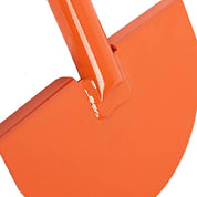 Closeup angle of half-moon edger blade showing welded shaft reinforcement.