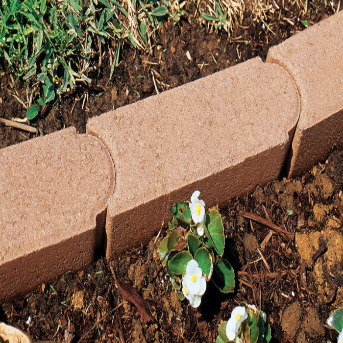 Edgestone Edger: Light brown concrete landscape edging for flowerbeds.
