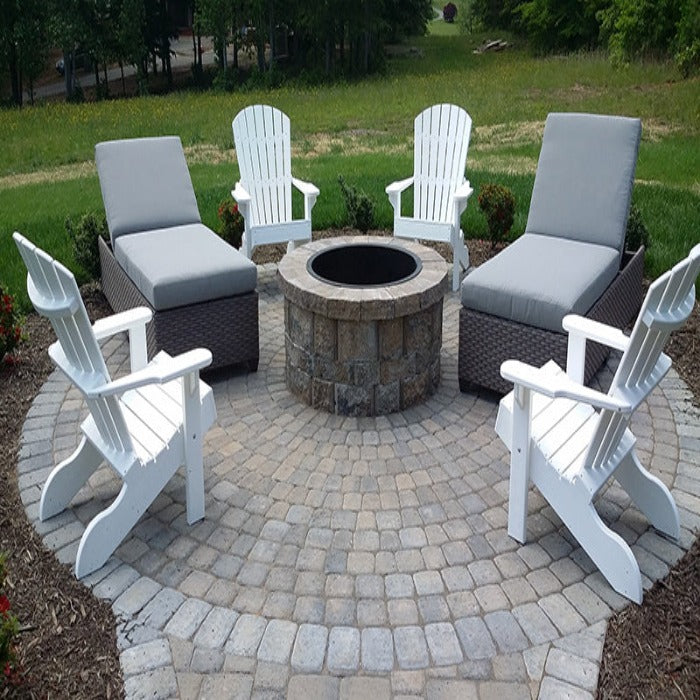 Plaza Rectangle 6x9 paver patio kit, 45mm thickness; gray pavers, white adirondack chairs, fire pit.
