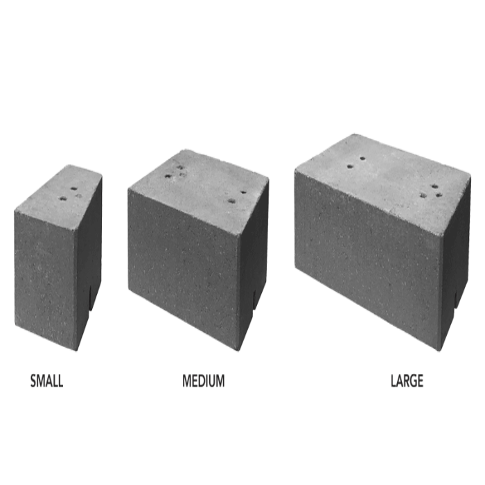 Gray concrete wall blocks in small, medium, and large sizes.
