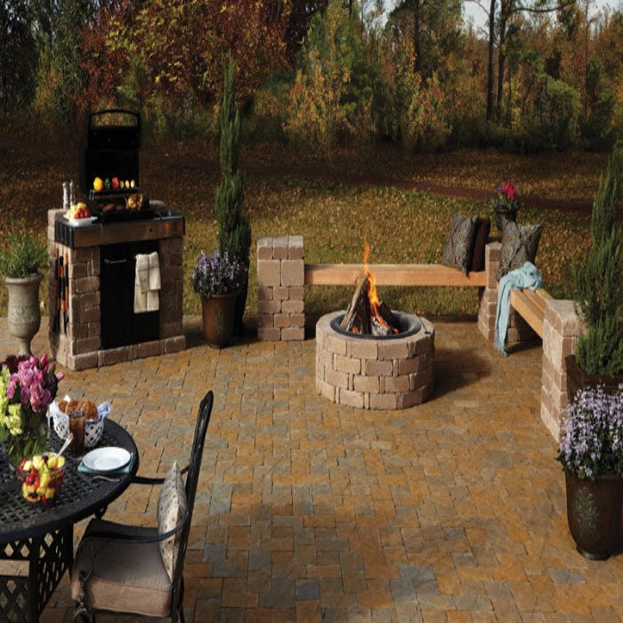 Rumblestone Jumbo Rectangle patio kit: fire pit, built-in grill, & seating.
