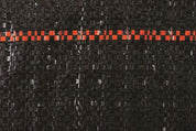 Black silt fence fabric detail, showing textured weave and orange marker stripe.
