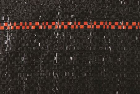 Black silt fence fabric detail, showing textured weave and orange marker stripe.

