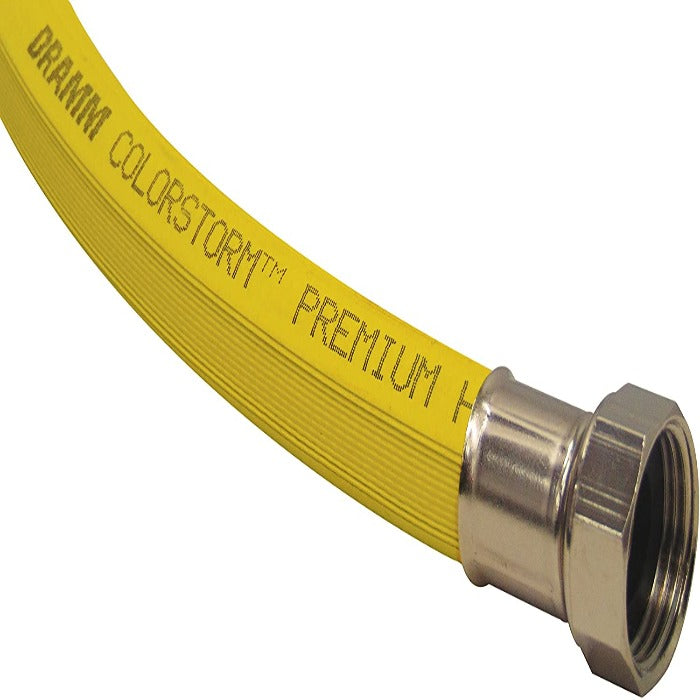 Yellow 1-inch Premium hose with metal fitting, close-up view.
