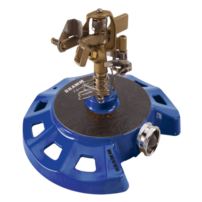 Blue metal circular sprinkler with brass top; garden irrigation.
