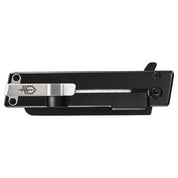 Black folding knife with a silver clip, detailed view.
