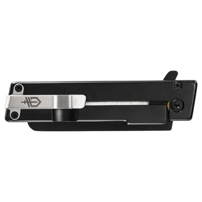 Black folding knife with a silver clip, detailed view.
