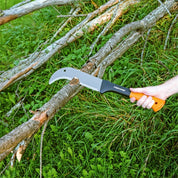 Brush axe cutting branches outdoors in grassy area.
