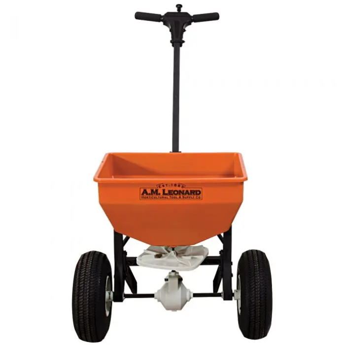 Orange 50lb capacity spreader with black wheels and handle, ideal for professional landscaping.
