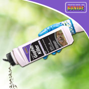 Gopher Killer poison bait being poured onto grass,  effective rodent control for lawns and gardens.
