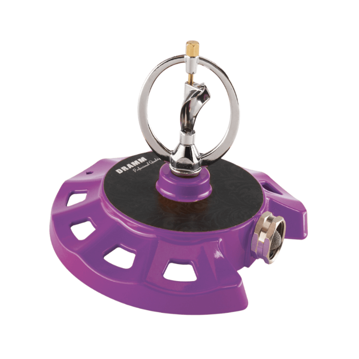 Purple metal spinning sprinkler with a chrome nozzle; garden irrigation.
