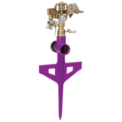 Purple circular sprinkler on a stake, brass spray head, for efficient garden watering.
