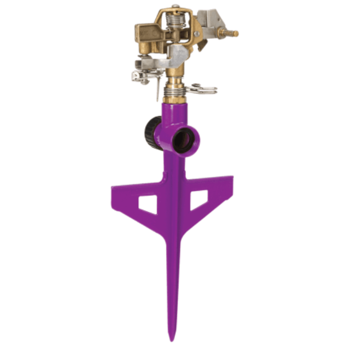 Purple circular sprinkler on a stake, brass spray head, for efficient garden watering.
