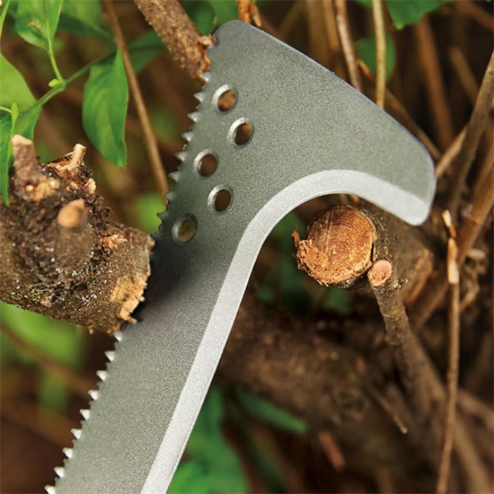 Grey metal billhook pruning branches, serrated blade detail.
