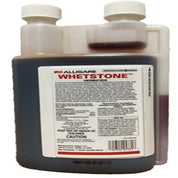 Dark brown liquid herbicide in a plastic bottle with detailed label instructions.
