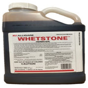 One-gallon jug of dark brown herbicide with detailed label instructions.
