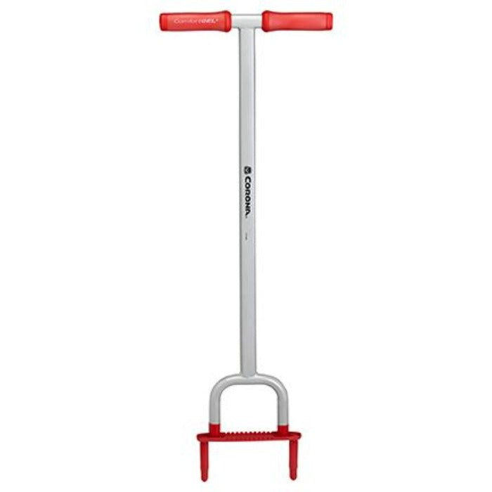 Corona YardBREATHER Lawn & Soil Aerator: Silver metal tool with red handles for easy lawn and soil aeration.
