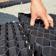 TuffTrack Grass Pavers: interlocking hexagonal plastic grid for permeable driveways and patios.

